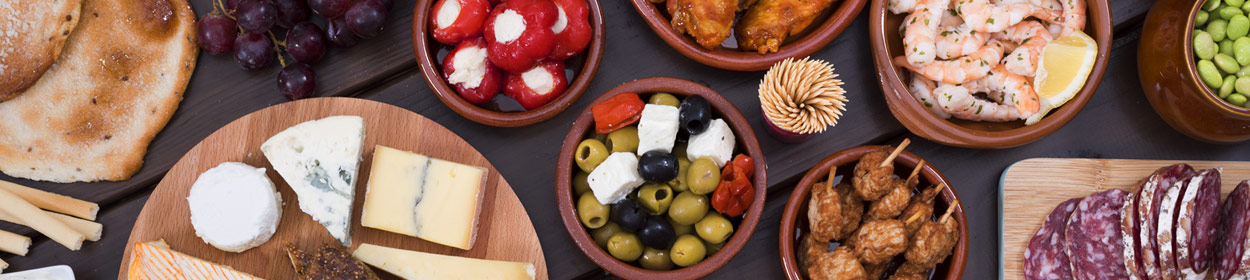 Local food to try in Majorca (Mallorca), Spain. Great Guide to typical Mallorquin food, including paella, ensaimadas, tapas and more!
